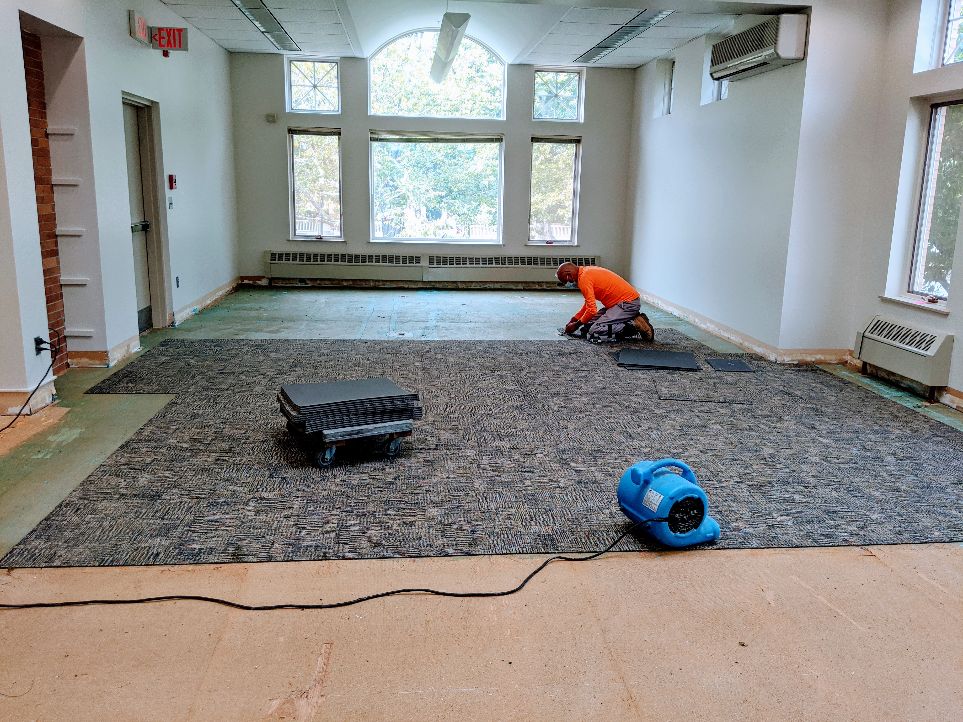 Carpet goes down in the 50's addition. 